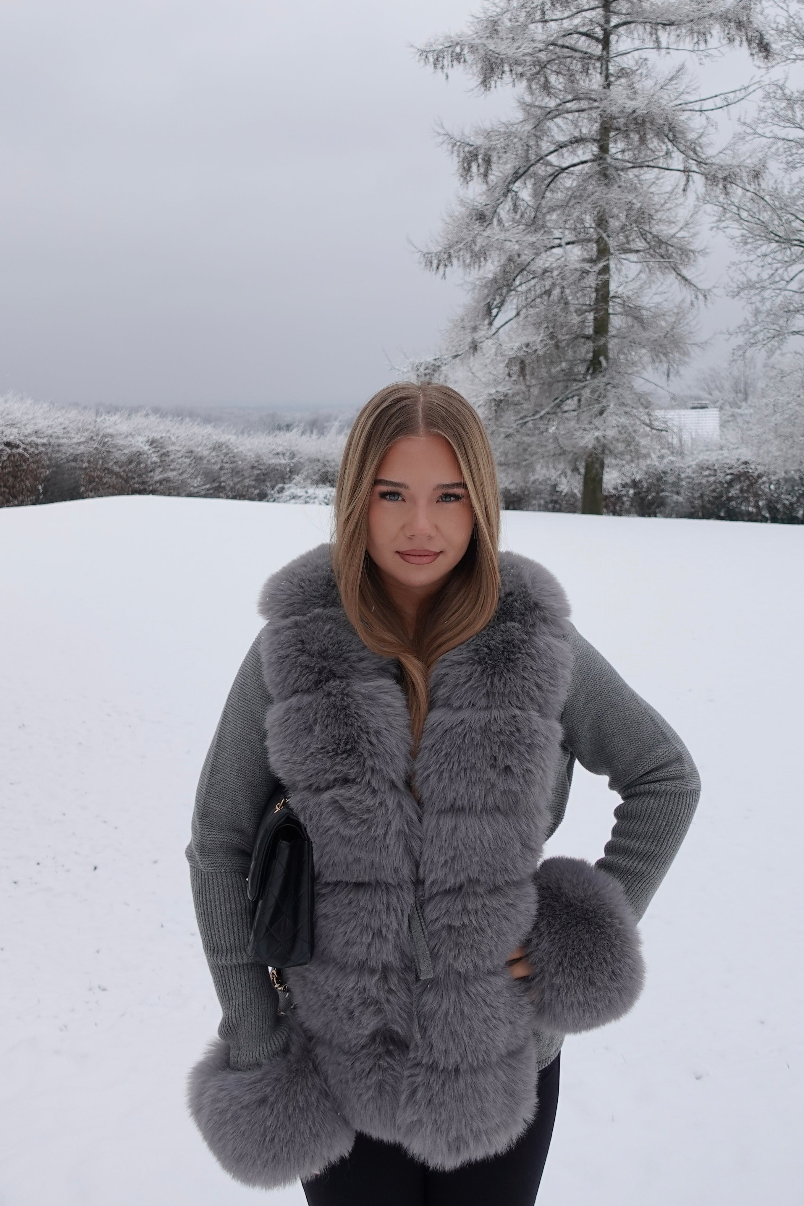 Hand-knitted fitted cardigan with fur details in Grey